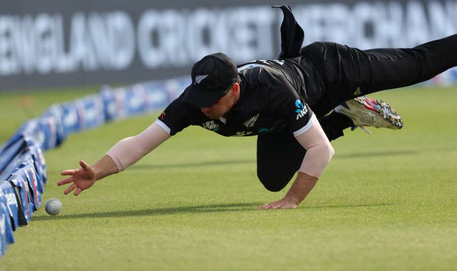 New Zealand's Will Young narrowly fails to stop a shot from England's Sam Curran reaching the boundary rope