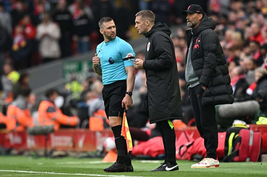 An irate Robertson was shown a yellow card in the aftermath as he had to be led away by teammates