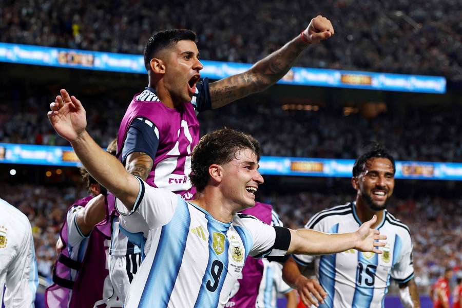 Argentina's Julian Alvarez celebrates scoring their second goal with Cristian Romero Argentina's Julian Alvarez celebrates scoring their second goal with Cristian Romero
