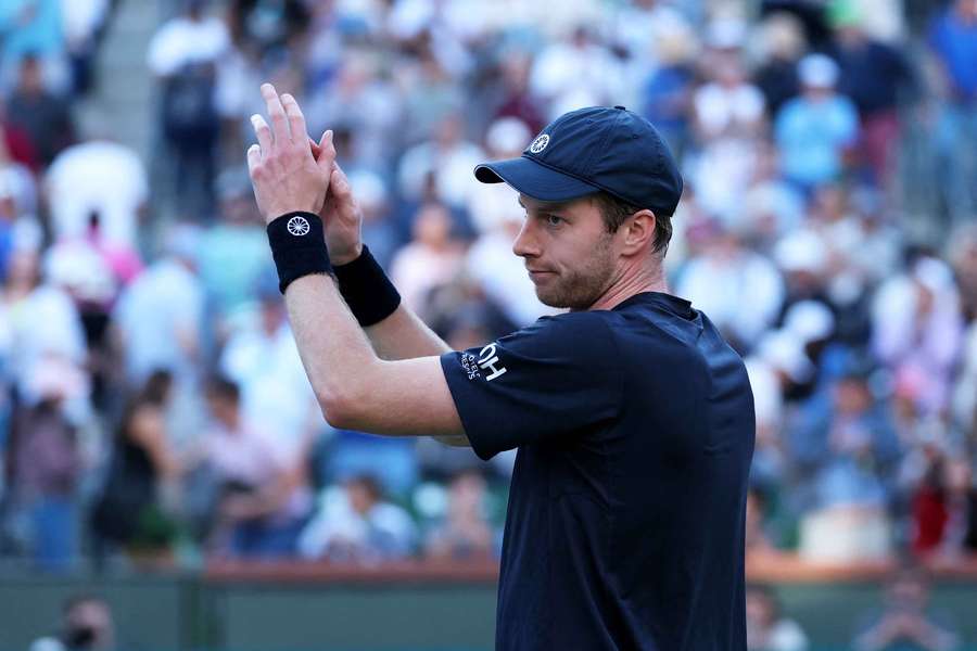 Botic van de Zandschulp applauds the crowd after beating Novak Djokovic at Indian Wells
