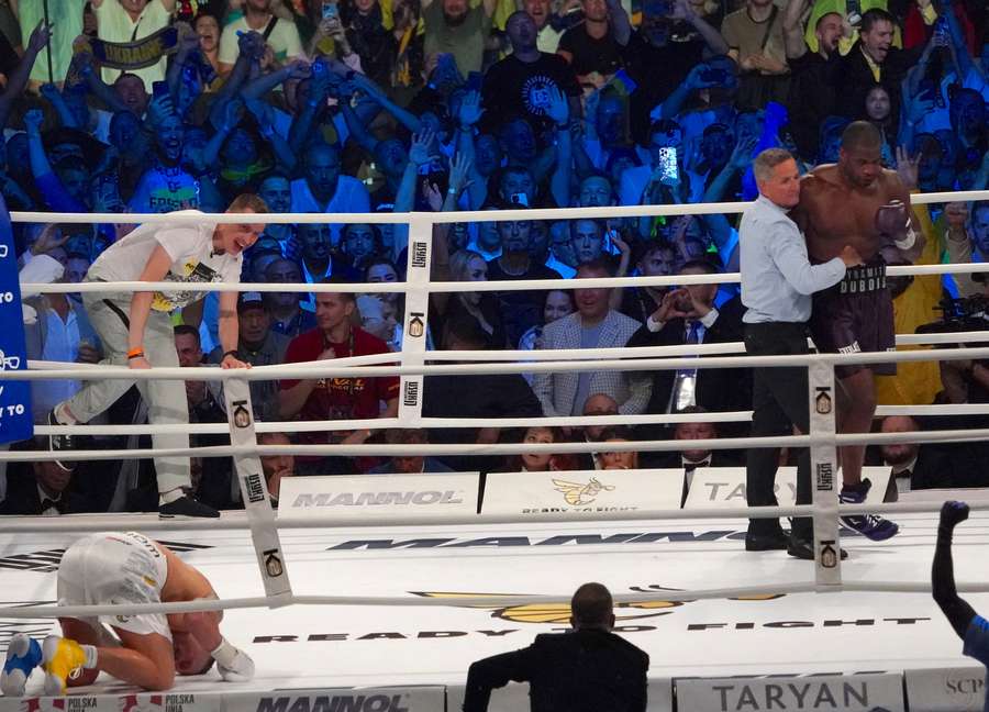 Ukraine’s reigning world heavyweight champion Oleksandr Usyk celebrates his KO victory