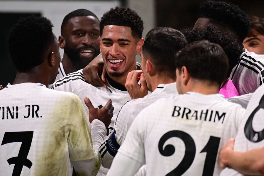 Jude Bellingham celebrates with teammates after scoring Real Madrid's third goal