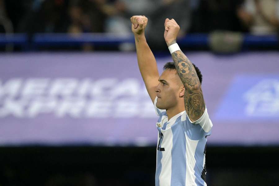 Lautaro Martinez pumps his fist in the air as Argentina continues their dominance over Peru with a 1-0 victory.