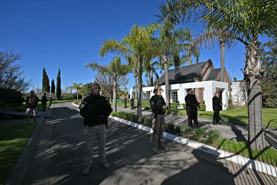 Security personnel at the entrance of El Prado cemetery Security personnel at the entrance of El Prado cemetery