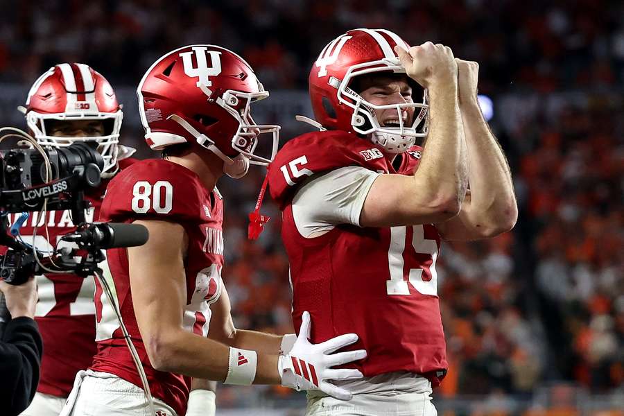 Indiana quarterback Fernando Mendoza (right) celebrates after a touchdown in College Football Championship