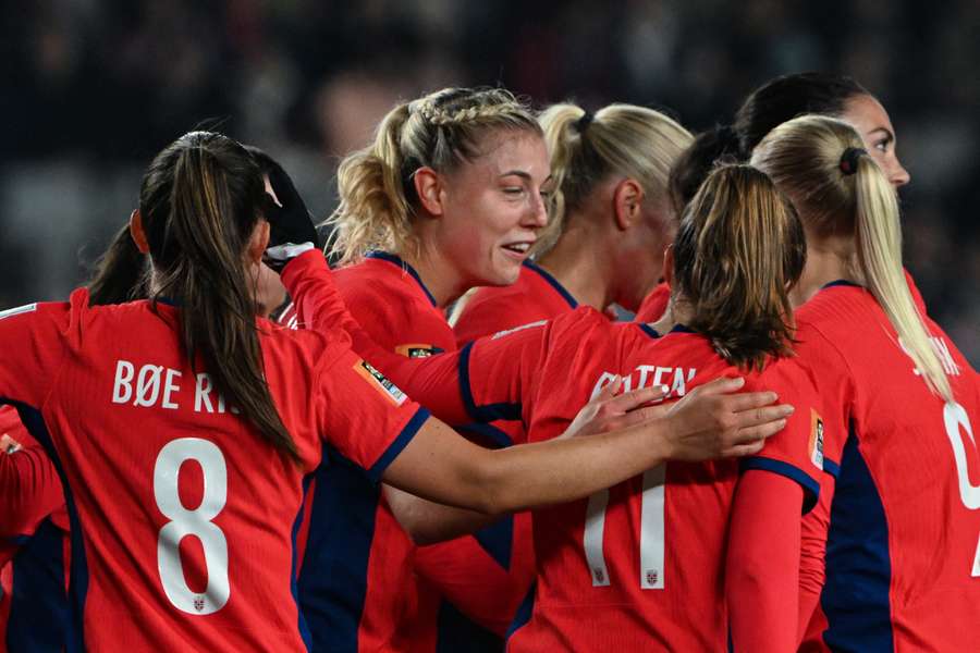 Norway's forward #22 Sophie Roman Haug (C) celebrates with her teammates after scoring her team's sixth goal 