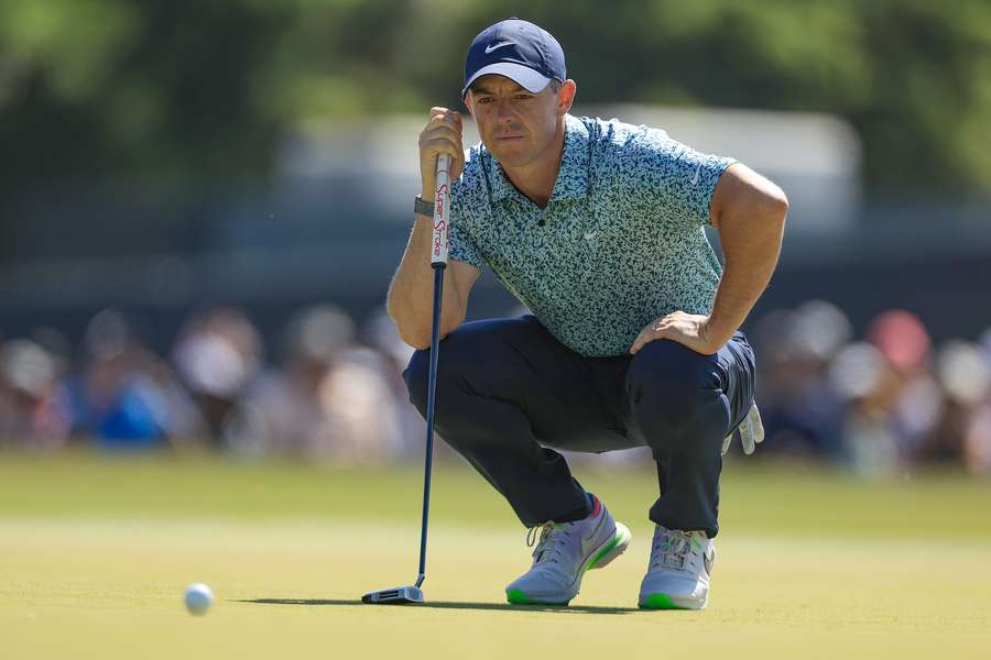 Rory McIlroy of Northern Ireland lines up a putt