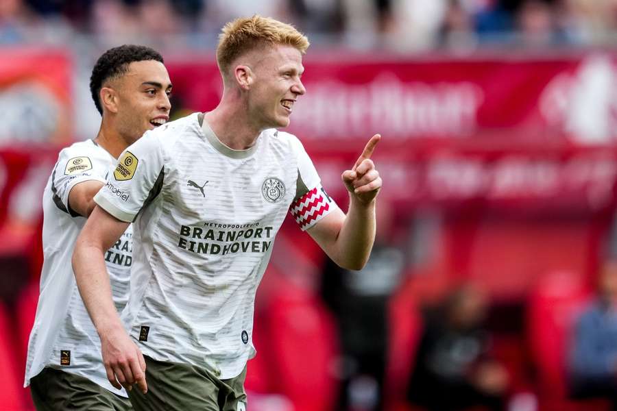 PSV captain Jerdy Schouten celebrates scoring the 2-0 against FC Twente with Sergino Dest (L)