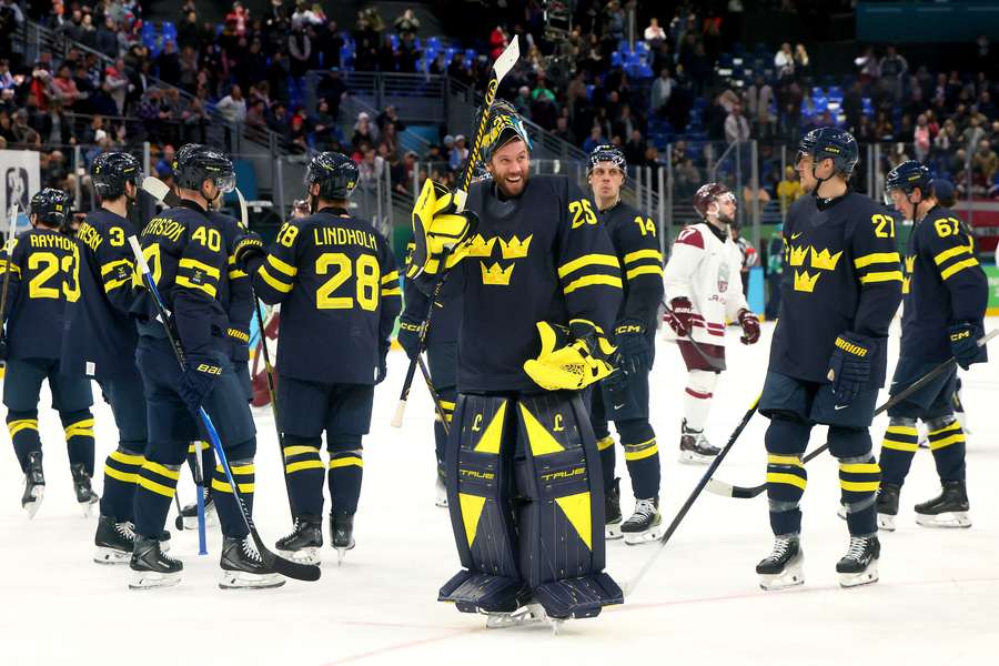 Sweden players celebrate after win over Latvia at 2026 Winter Olympics