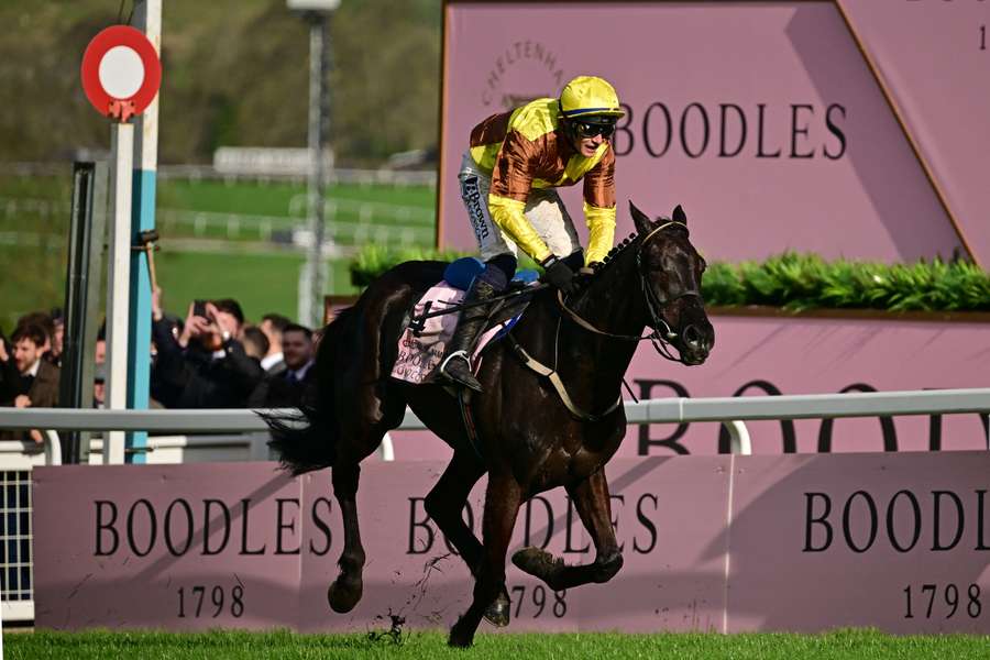 Paul Townend rides Galopin Des Champs past the finish post win the Gold Cup