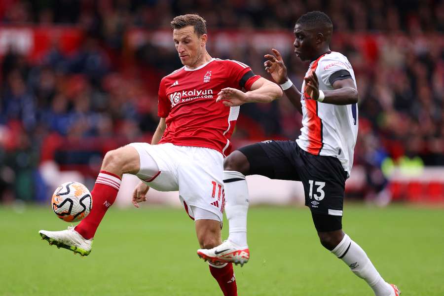 Chris Wood of Nottingham Forest and Marvelous Nakamba of Luton Town compete for the ball