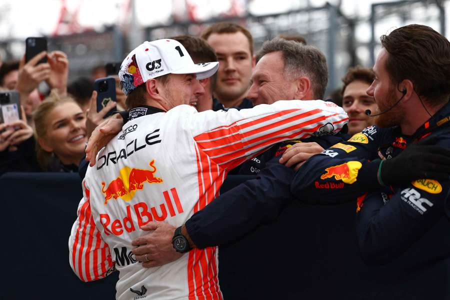 Max Verstappen hugs Red Bull team principal Christian Horner and celebrates winning the Japanese Grand Prix