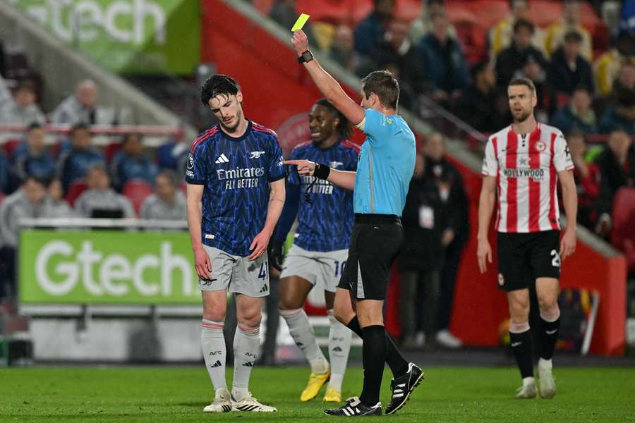Declan Rice receives a yellow card during Arsenal's 1-1 draw with Brentford in the Premier League on Thursday.