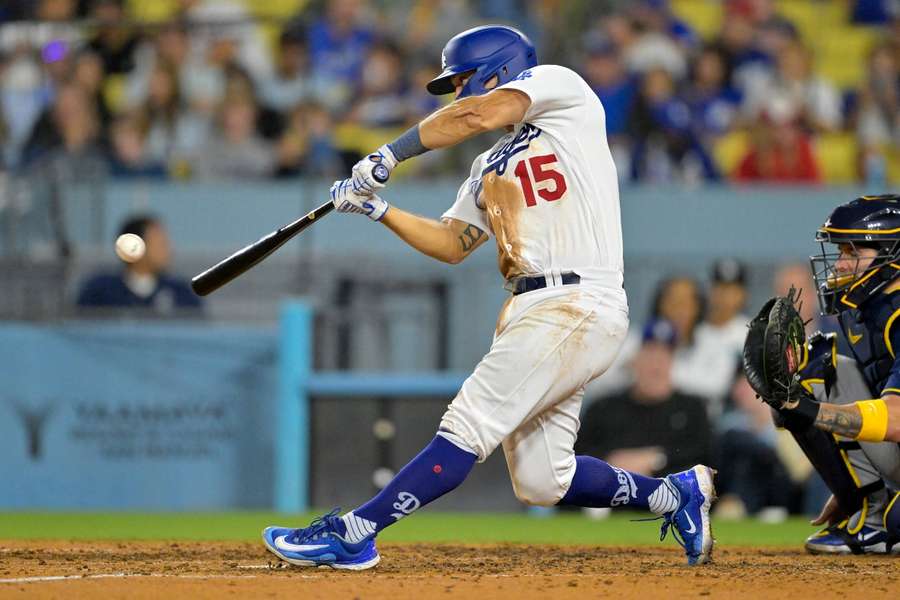 Los Angeles Dodgers catcher Austin Barnes hits a solo home run in the eighth inning against the Milwaukee Brewers at Dodger Stadium