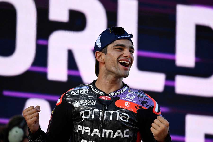 Jorge Martin celebrates on the podium after winning the MotoGP World Championship