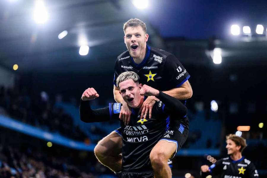 Robbie Ure carries Tobias Anker amid Sirius' celebrations