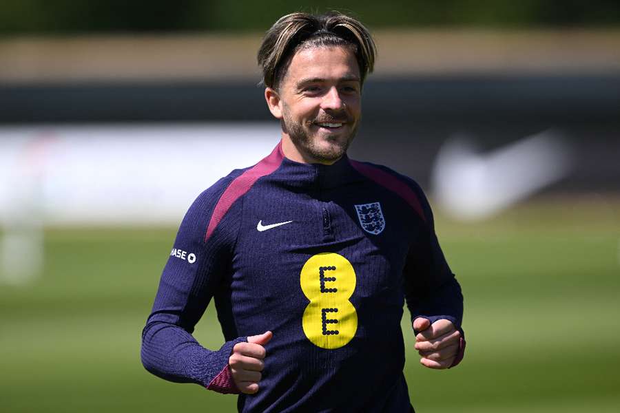 England's Jack Grealish smiles during a training session