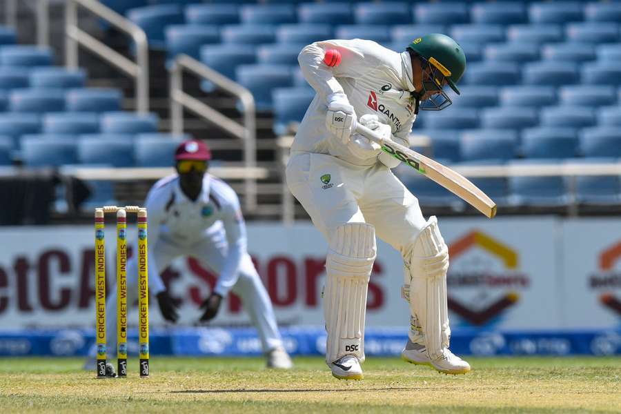 Australia batter Usman Khawaja is struck on the arm by a pink ball during a day-night Test. Australia batter Usman Khawaja is struck on the arm by a pink ball during a day-night Test.