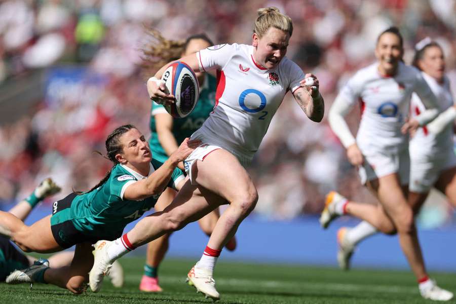 England's Megan Jones runs away from Ireland's Emily Lane
