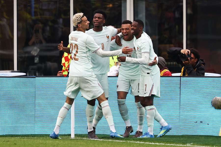 Kylian Mbappe is congratulated by his France teammates after scoring the opener 