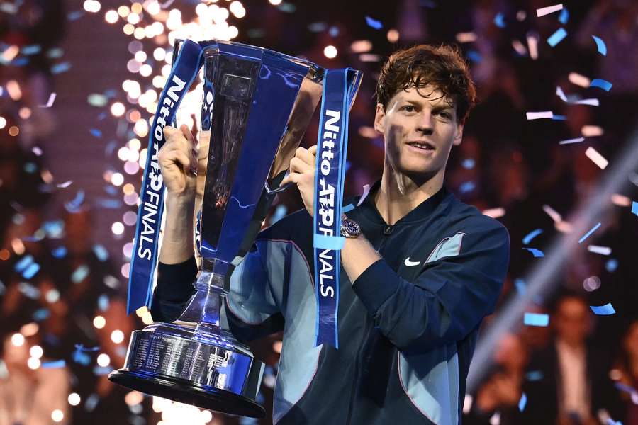 Jannik Sinner lifts the ATP Finals trophy after beating Taylor Fritz in Turin on Sunday