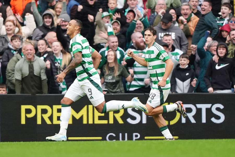 Celtic's Adam Idah (left) celebrates scoring their side's third goal 