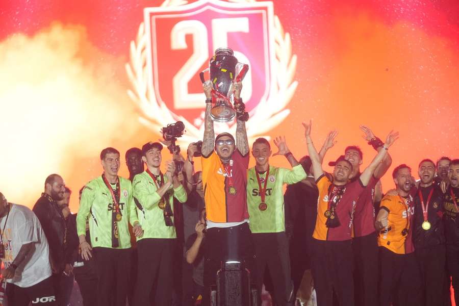 Galatasaray players lift the trophy Galatasaray players lift the trophy