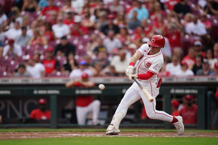 Reds centre fielder Friedl (29) hits the ball during the fourth inning