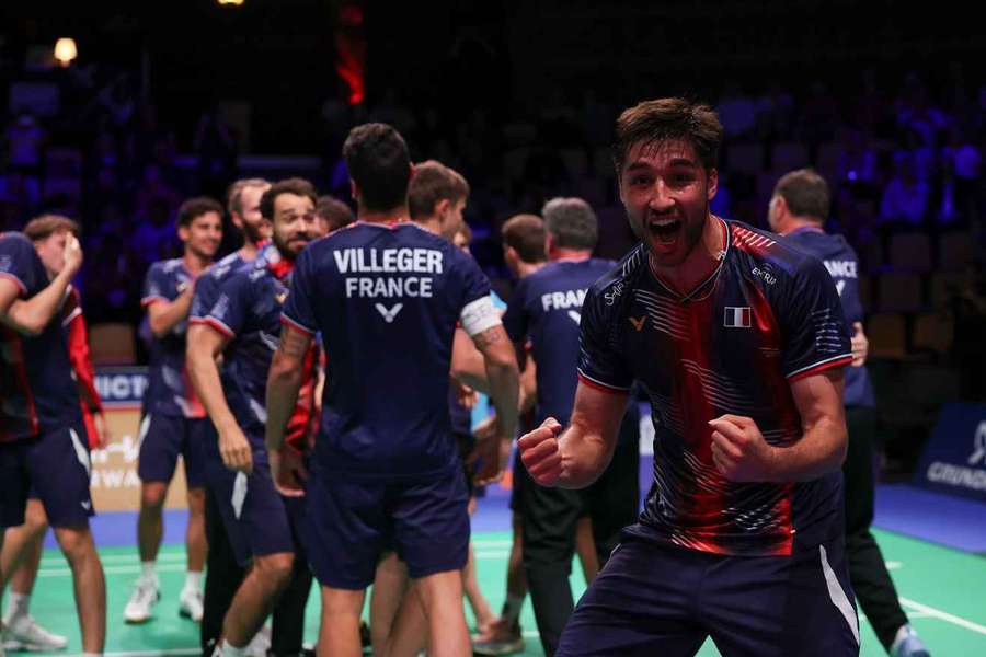 The French team celebrate after the semifinal match against India at the BWF Thomas Cup Finals in Horsens