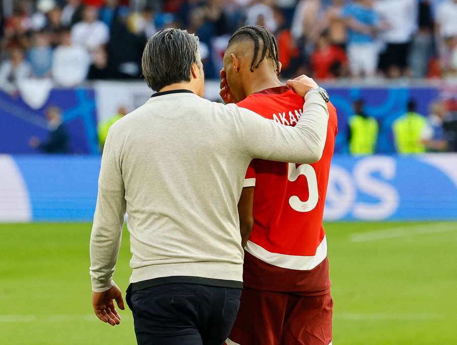 Murat Yakin consoles Manuel Akanji after his penalty miss