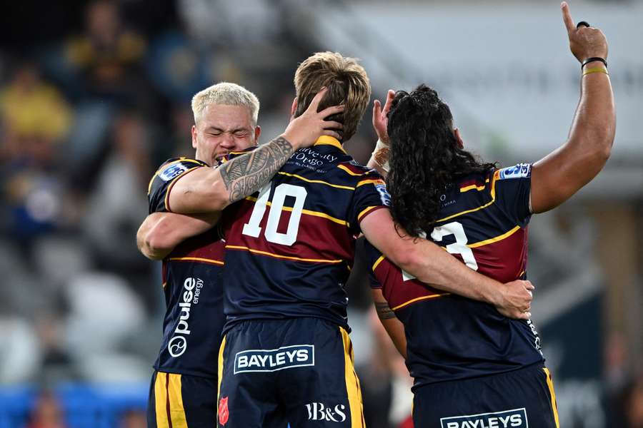 Crusaders players celebrate their season-opening victory in Dunedin. Crusaders players celebrate their season-opening victory in Dunedin.