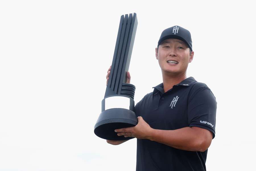 Danny Lee poses with the trophy