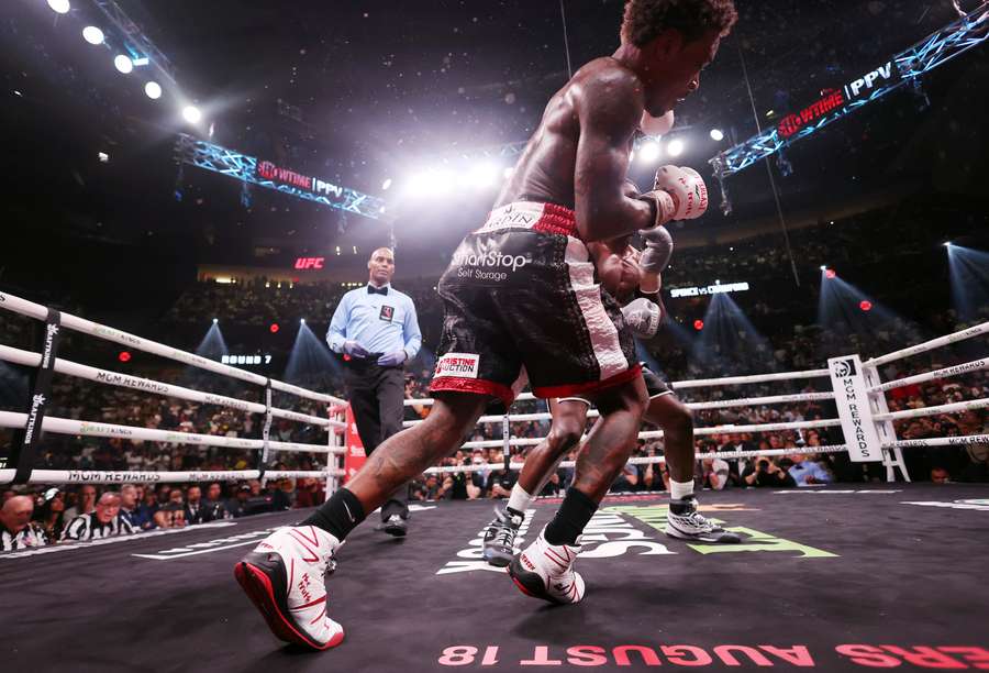 Errol Spence Jr. is punched by Terrence Crawford during round 7