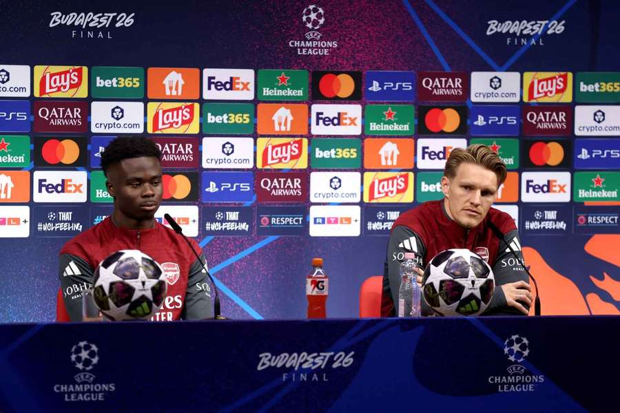 Saka and Odegaard speaking at the press conference. Saka and Odegaard speaking at the press conference.
