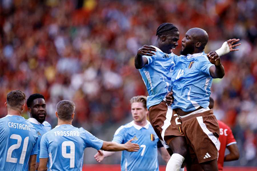 Belgium's Romelu Lukaku (R) celebrates scoring his team's first goal with Amadou Onana