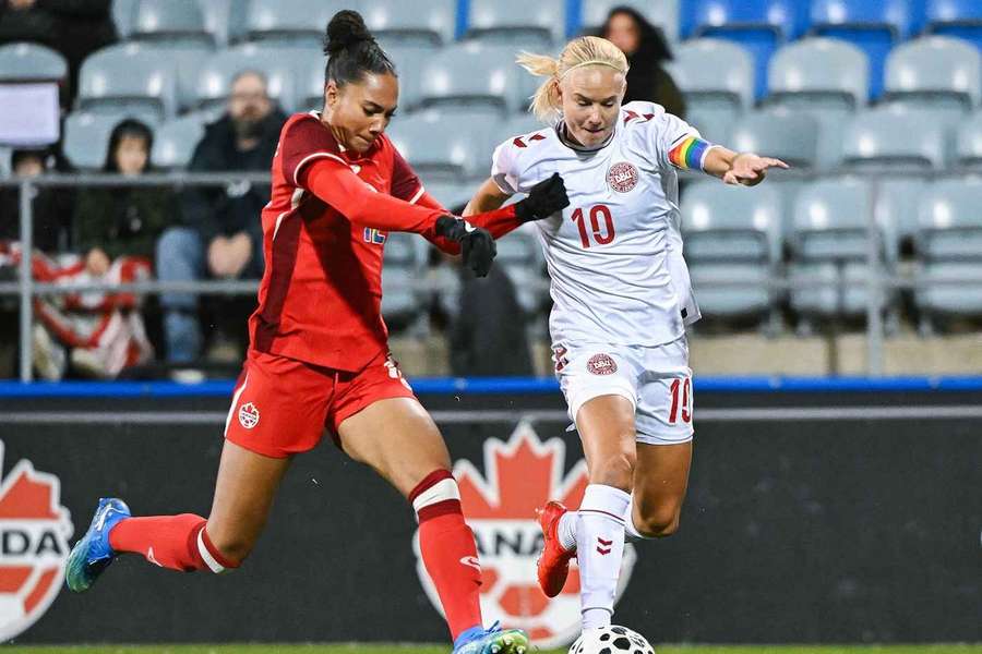 Canada's Jade Rose, left, and Denmark's Pernille Harder tussle for the ball