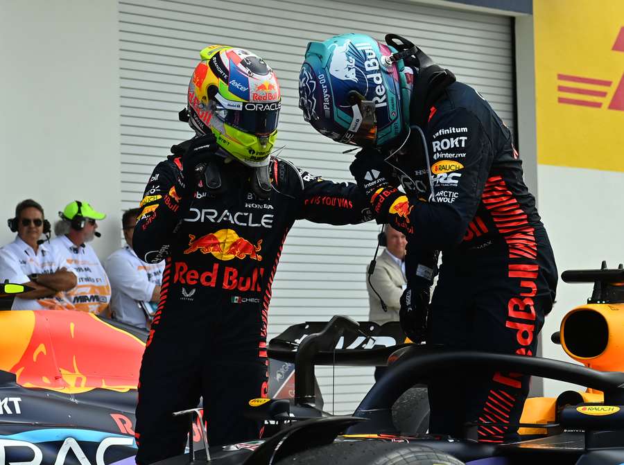 Red Bull Racing's Dutch driver Max Verstappen (R) celebrates with teammate Mexican driver Sergio Perez