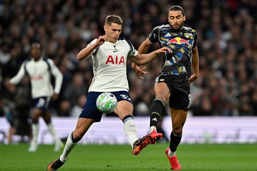 Tottenham's Micky van de Ven challenges Leeds' Dominic Calvert-Lewin