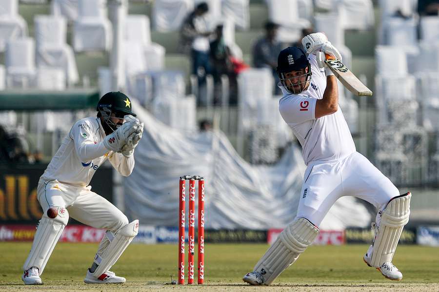 England's Liam Livingstone (R) plays a shot during the second day of the first cricket Test match between Pakistan and England