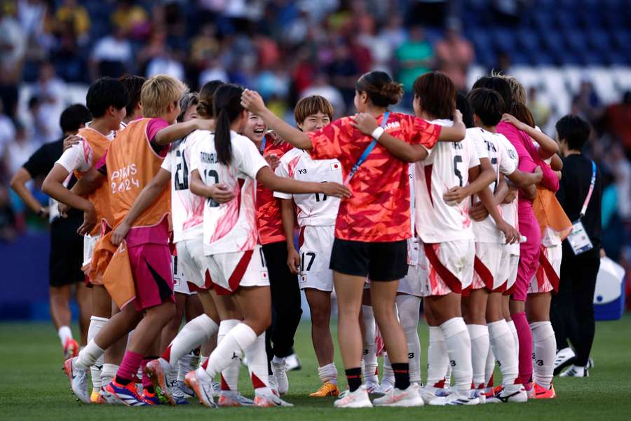 Japan celebrate after their victory over Brazil