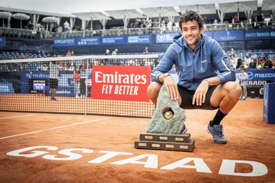 Matteo Berrettini poses with the trophy after winning the Gstaad final