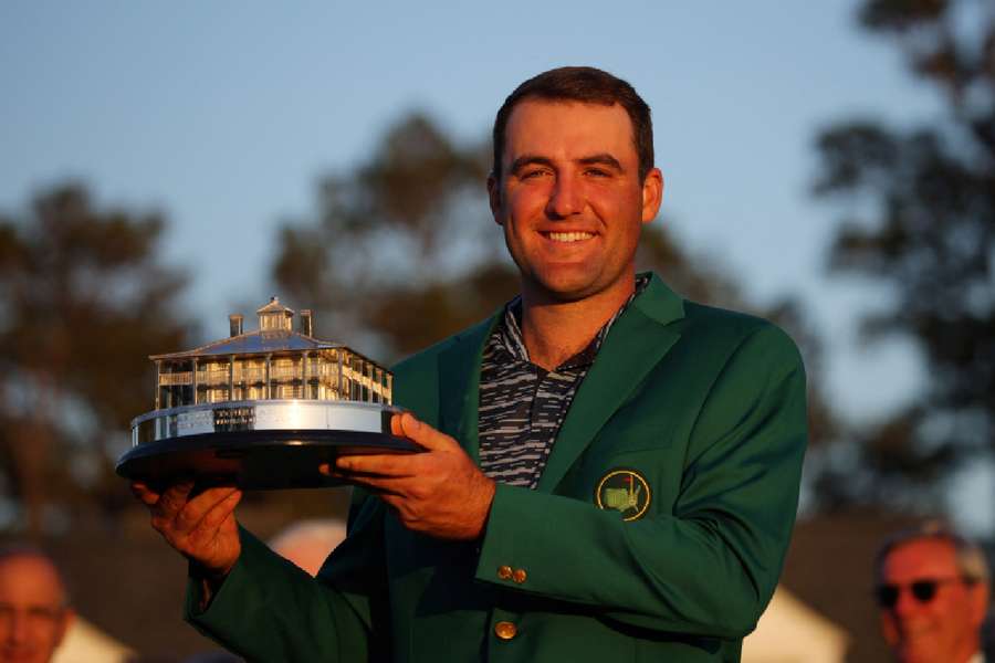 Scottie Scheffler poses with the trophy after winning The Masters in 2022