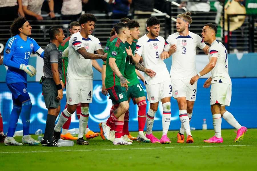 The USA and Mexico players confront each other