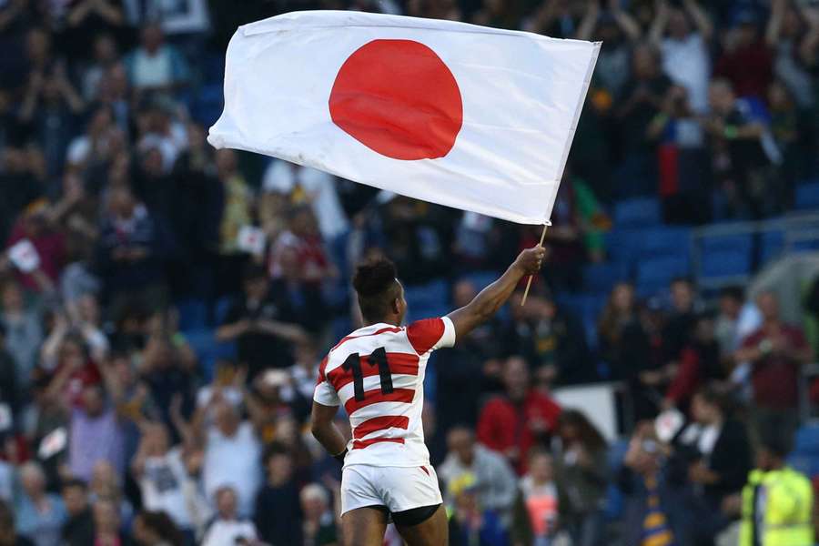 Japanese winger Kotaro Matsushima waves the flag after their historic win in 2015. Japanese winger Kotaro Matsushima waves the flag after their historic win in 2015.