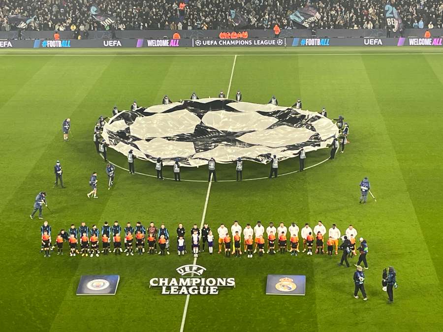 Man City and Real Madrid players line-up before kickoff