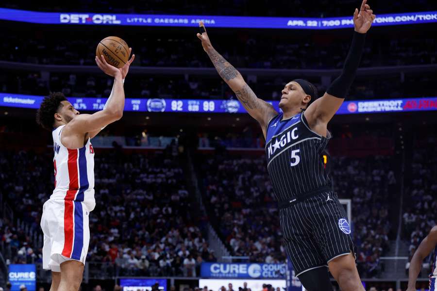 Detroit Pistons guard Cade Cunningham shoots on Orlando Magic forward Paolo Banchero in the second half