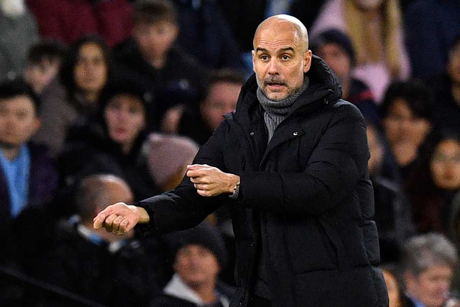 Pep Guardiola gestures on the touchline during the FA Cup third round football match between Manchester City and Chelsea