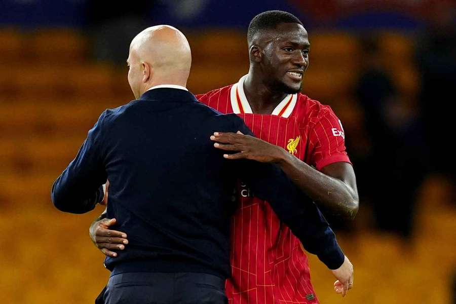 Ibrahima Konate, right, embraces Arne Slot