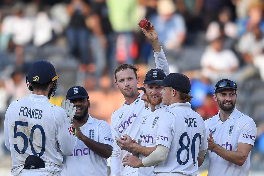 Tom Hartley (C) celebrates after taking five-wicket haul during the fourth day of the first Test cricket match between India and England 