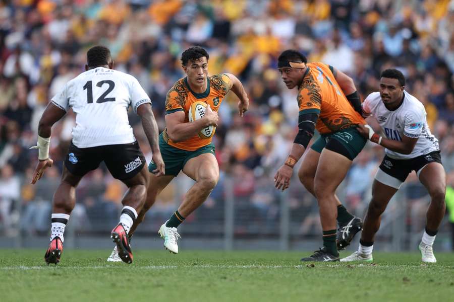 Joseph-Aukuso Suaalii runs at the Fiji defence last Sunday in Newcastle.
